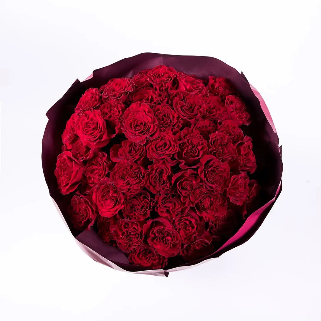 A bouquet of four dozen red roses, top view