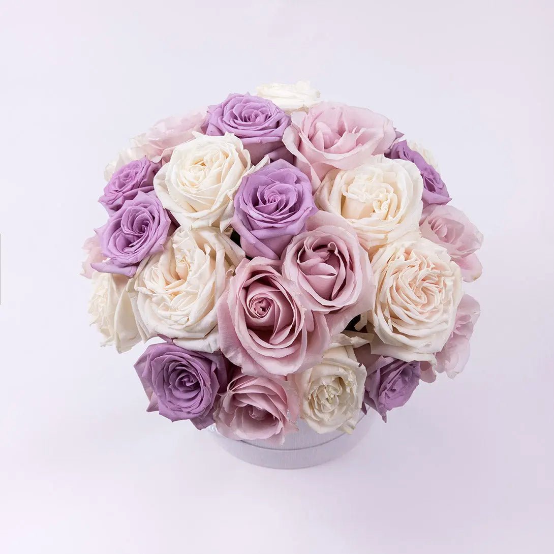 Combination of premium roses in ivory, pink and lavender top view